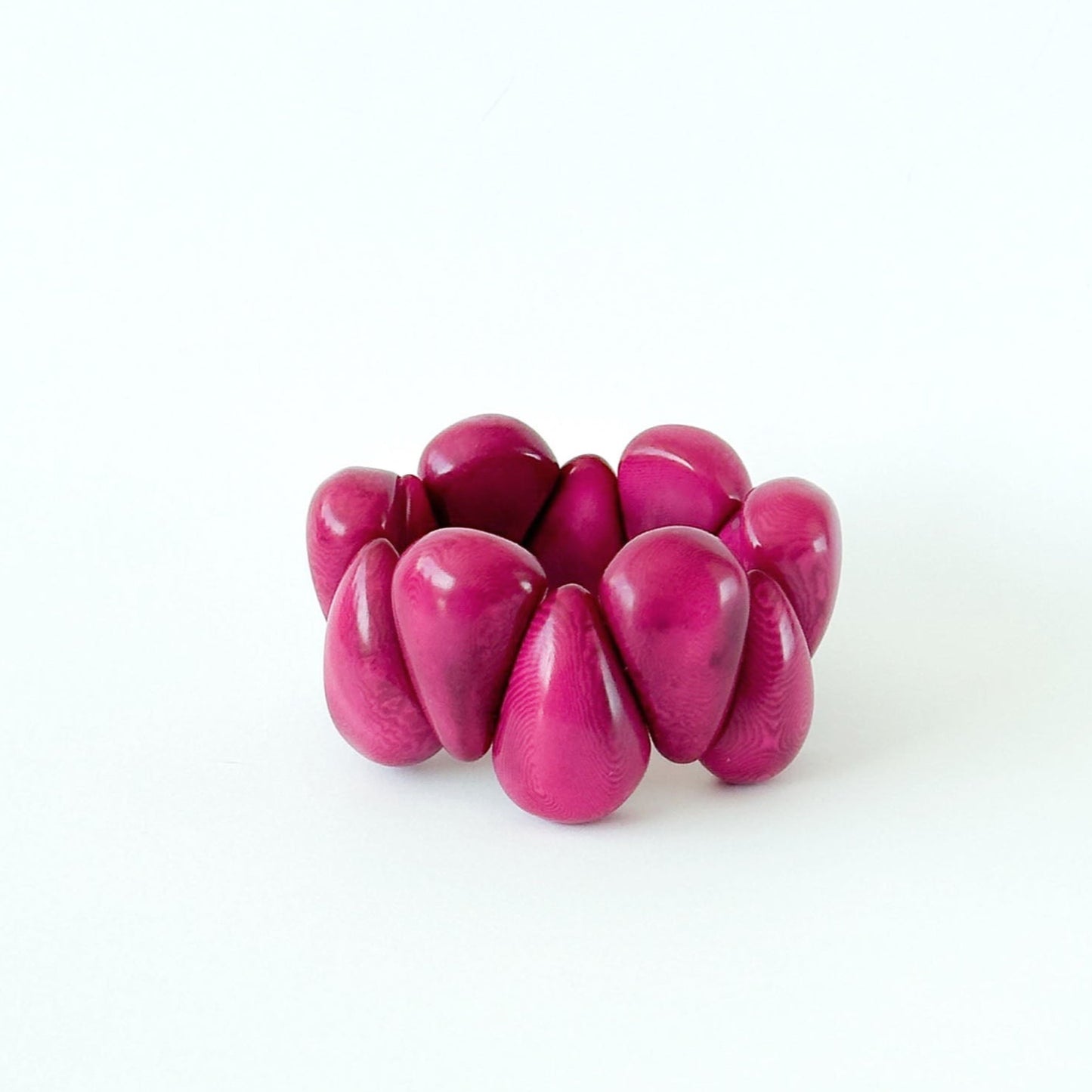 Armbånd i taguanøtt, fucsia